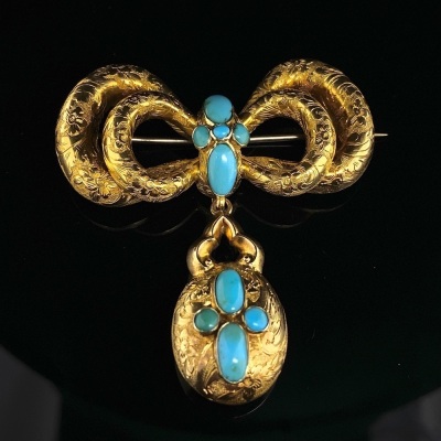 AN ANTIQUE AUSTRALIAN TURQUOISE SET MORNING BROOCH