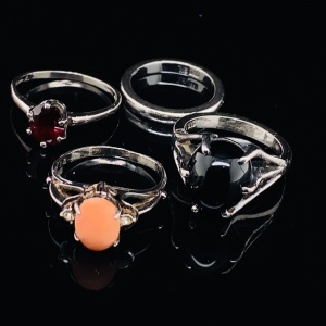 FOUR SILVER RINGS - THREE GEM SET