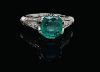 AN EMERALD AND DIAMOND RING