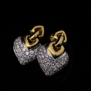 A PAIR OF DIAMOND EARRINGS