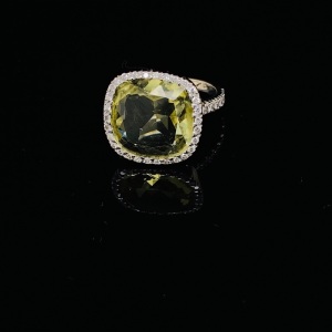 A YELLOW CITRINE AND DIAMOND DRESS RING