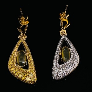 A PAIR OF DIAMOND EARRINGS