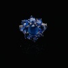 A SAPPHIRE AND DIAMOND FLOWER CLUSTER RING