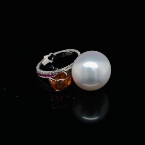 A SOUTH SEA PEARL, OPAL AND DIAMOND RING