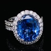 AN IMPRESSIVE CEYLON SAPPHIRE AND DIAMOND CLUSTER RING - 14