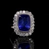 A TANZANITE AND DIAMOND RING - 4