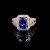 A TANZANITE AND DIAMOND CLUSTER RING