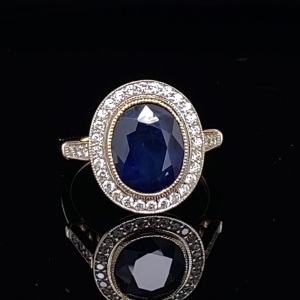 A BURMESE SAPPHIRE AND DIAMOND CLUSTER RING