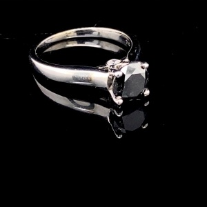 A SOLITAIRE BLACK DIAMOND RING
