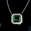 AN EMERALD AND DIAMOND PENDANT NECKLACE