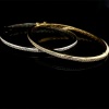 A PAIR OF GOLD AND DIAMOND HINGED BANGLES - 2