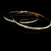 A PAIR OF GOLD AND DIAMOND HINGED BANGLES - 6