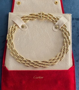 A GOLD NECKLACE BY CARTIER