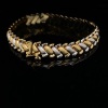 A GOLD BRACELET BY SIMYA - 2