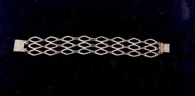 A MID CENTURY STERLING SILVER BRACELET