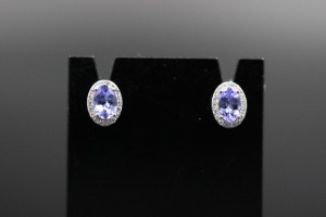 A PAIR OF TANZANITE AND DIAMOND STUDS