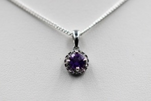 AN AMETHYST AND DIAMOND PENDANT