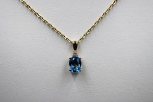 A TOPAZ AND DIAMOND PENDANT