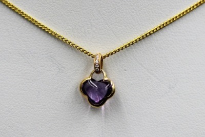 AN AMETHYST AND DIAMOND PENDANT