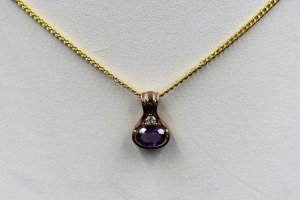 AN AMETHYST AND DIAMOND PENDANT