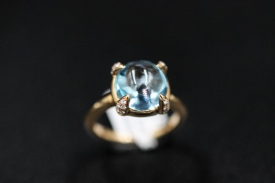 A TOPAZ AND DIAMOND RING