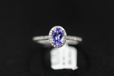 A TANZANITE AND DIAMOND RING