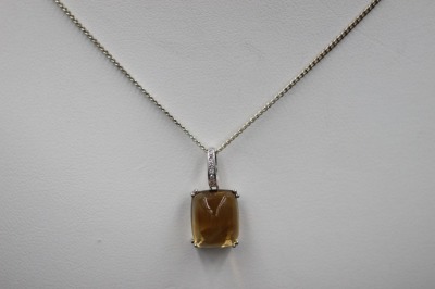 A CITRINE AND DIAMOND PENDANT