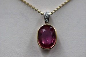 A PINK SAPPHIRE AND DIAMOND PENDANT