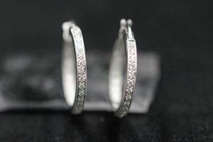 A PAIR OF DIAMOND HUGGIE EARRINGS