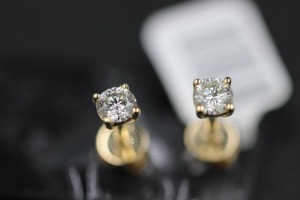 A PAIR OF DIAMOND STUDS