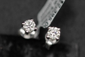 A PAIR OF DIAMOND STUDS