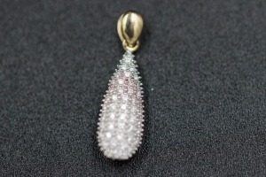 A DIAMOND PENDANT - SOLD AT AINGER