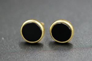 A PAIR OF ONYX STUDS