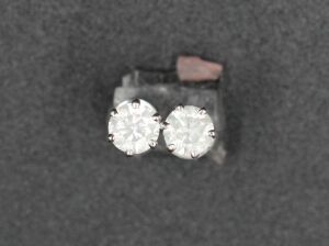 A PAIR OF DIAMOND STUDS