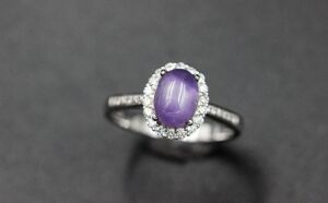 A PURPPLE SAPPHIRE AND DIAMOND RING