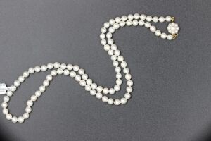 A VINTAGE LONG AKOYA PEARL NECKLACE