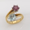 A GEM SET CROSSOVER RING - 2