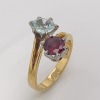 A GEM SET CROSSOVER RING - 3