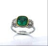 AN EMERALD AND DIAMOND RING