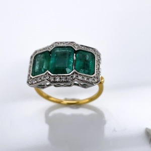 AN EMERALD AND DIAMOND RING