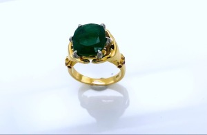 AN EMERALD AND DIAMOND RING