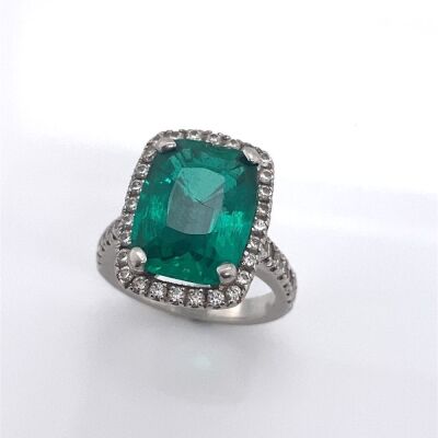 A HYDROTHERMAL EMERALD AND DIAMOND RING