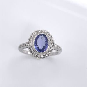 A TANZANITE AND DIAMOND RING