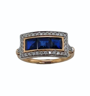 A SAPPHIRE AND DIAMOND RING