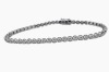 A DIAMOND TENNIS BRACELET - 3