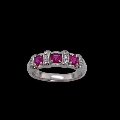 A THREE RUBY AND DIAMOND RING