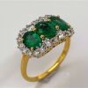 AN EMERALD AND DIAMOND TRILOGY RING - 2