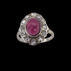 AN ANTIQUE TOURMALINE AND DIAMOND CLUSTER RING