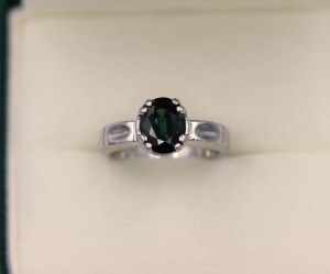 A GREEN SAPPHIRE AND DIAMOND RING