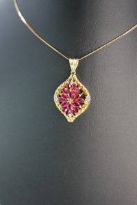 A VINTAGE RUBY AND DIAMOND PENDANT NECKLACE